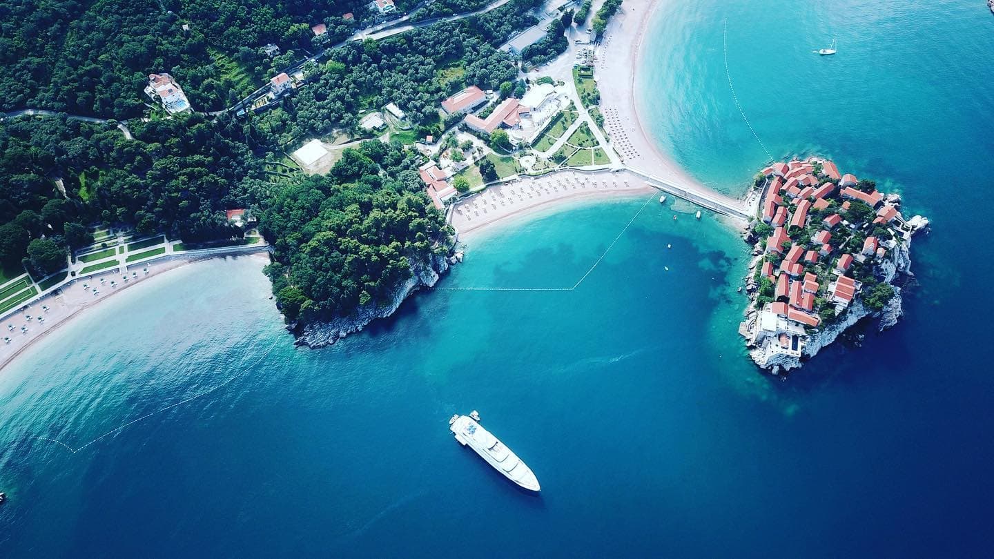 Yacht at anchor off Sveti Stefan, Montenegro, seen from the air