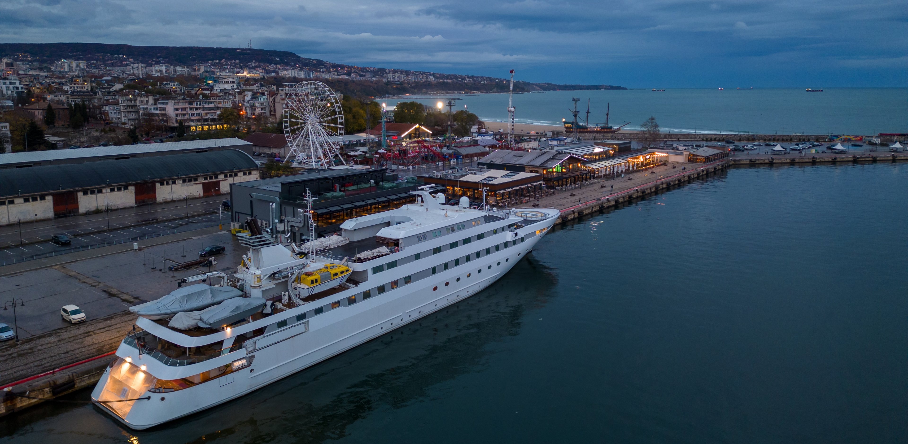 Quay Maritime seeks to identify the very best individuals for your needs. A superyacht berthed at a city quay at dusk, seen from the air